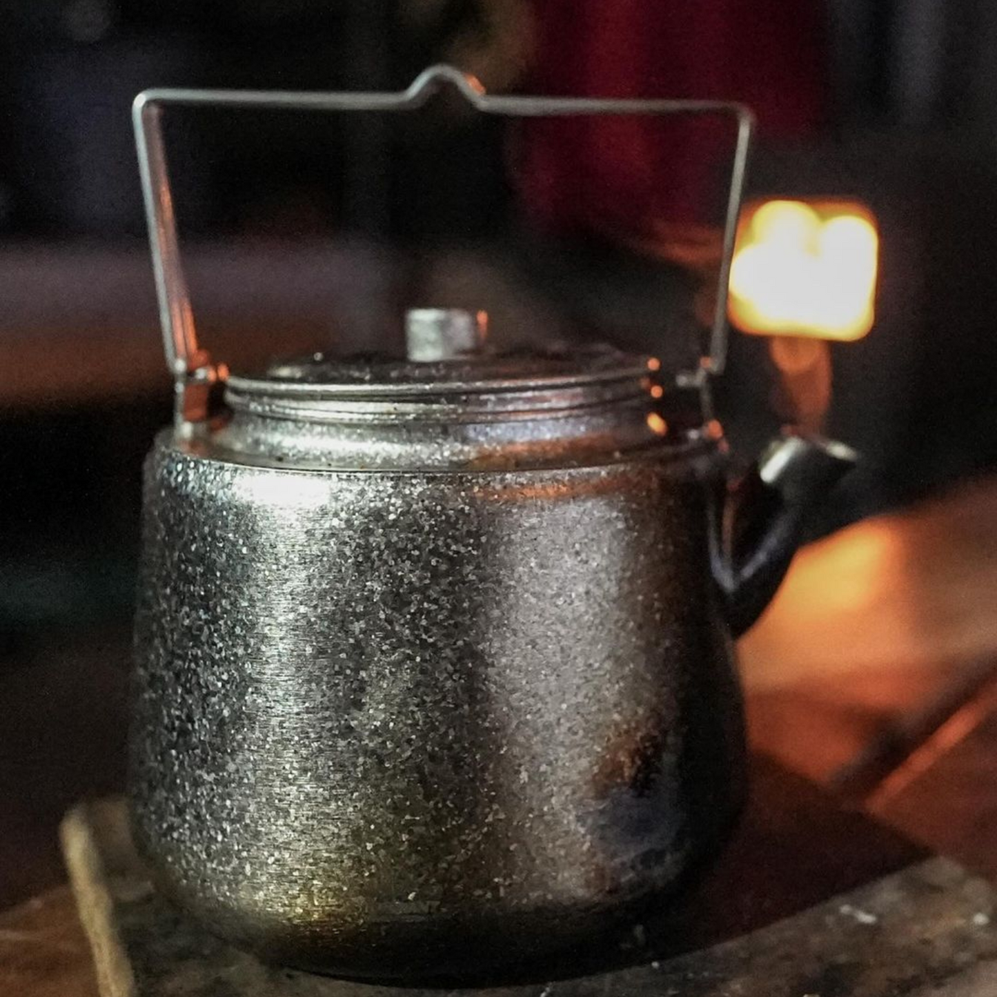 SilverAnt Titanium Bushcraft Kettle 1500ML - Crystallized Finish - in use image - on the table