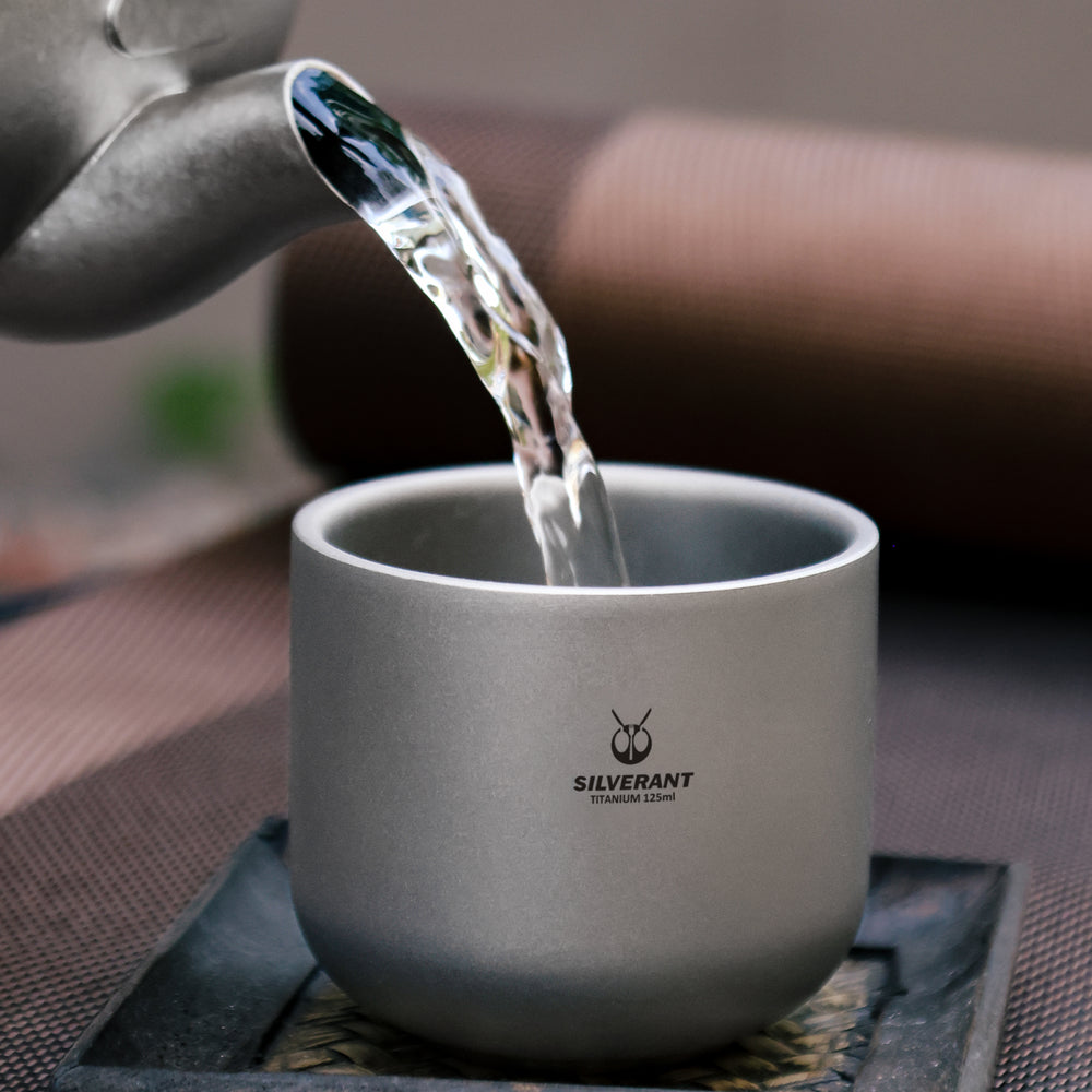 
                  
                    SilerAnt Outdoors Titanium Tea Cup Double Wall 125ml/4.22 fl oz Sandblasted Finish in use image pouring water in it
                  
                