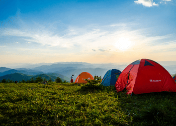 SilverAnt Outdoors 3 Tents Pitched With Sun Shining With A Beautiful Mountainous Horizon