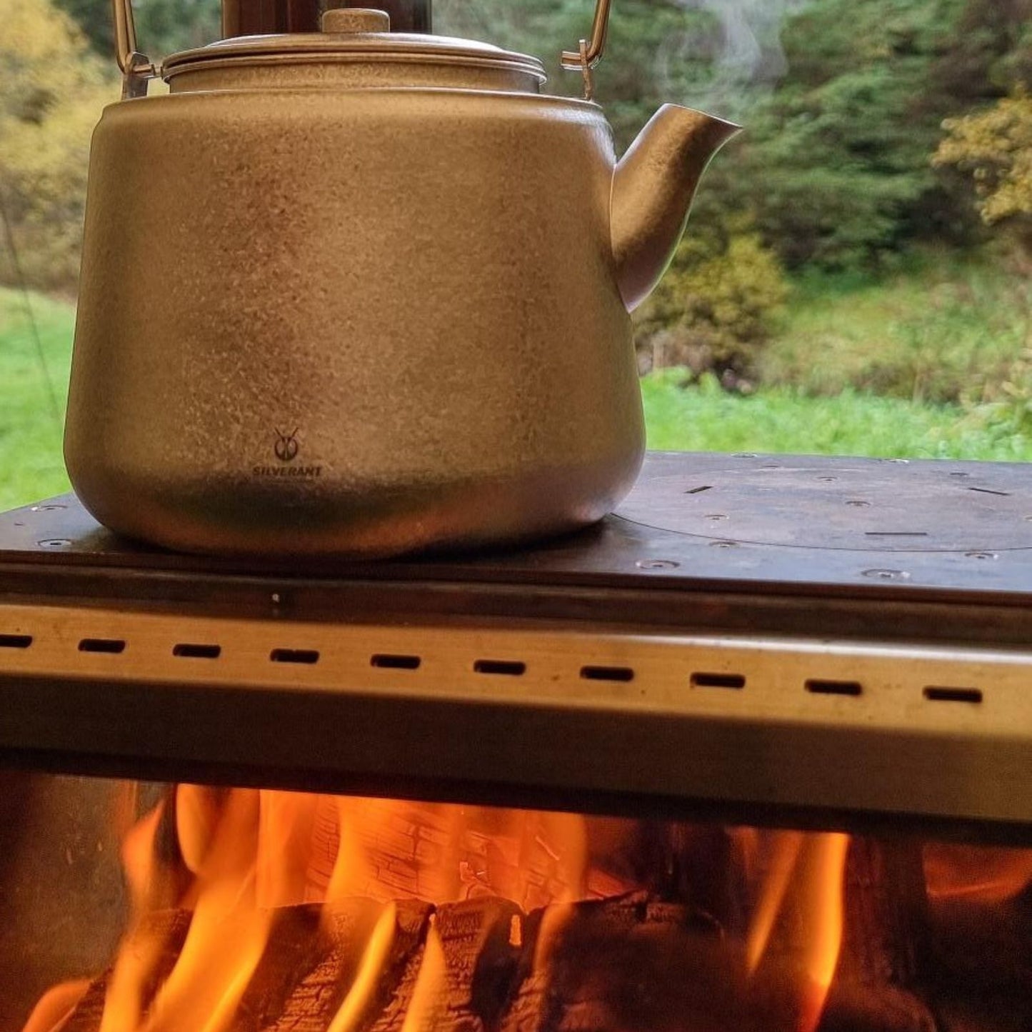Titanium Bushcraft Kettle - Crystallized Finish 900ml on the tent stove
