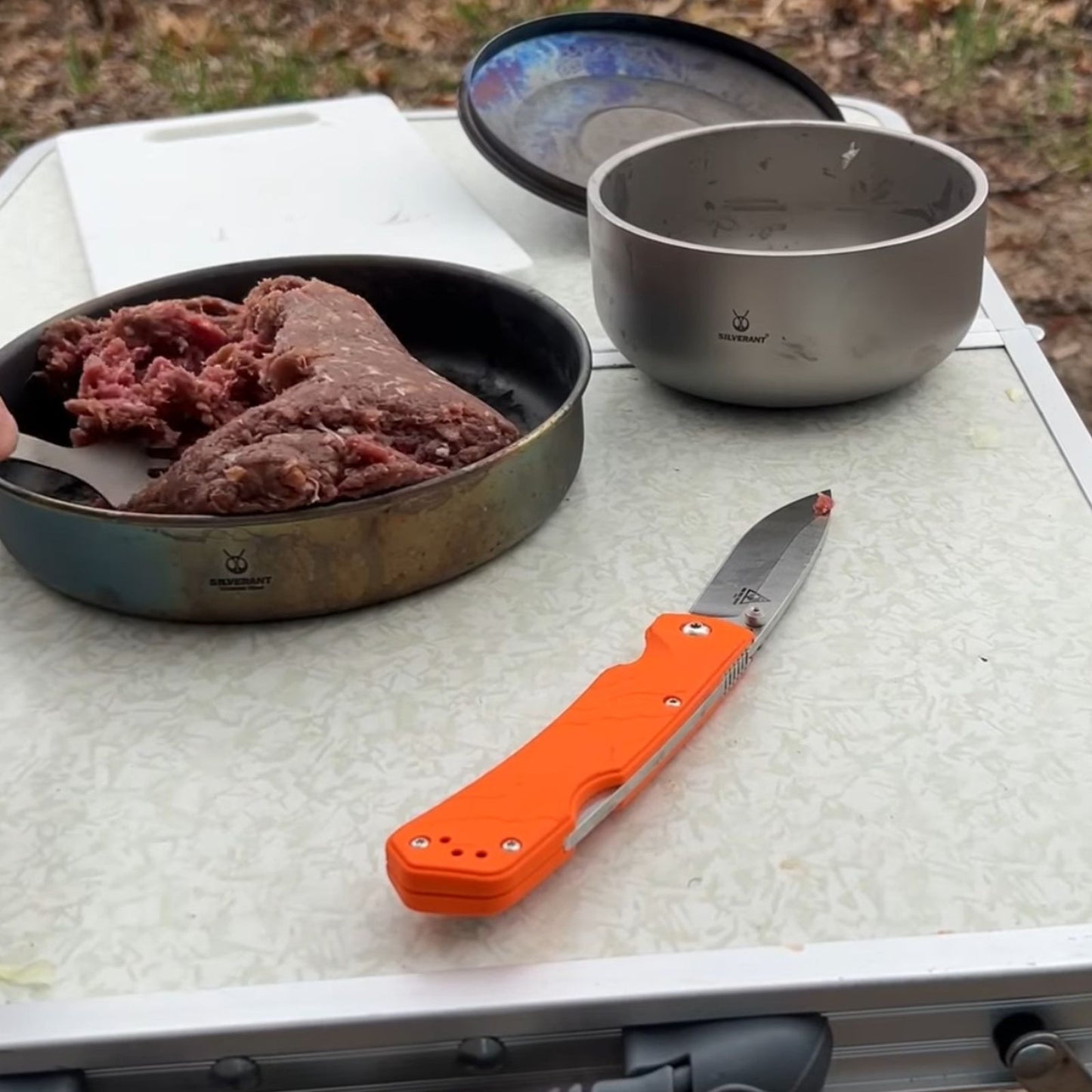 SilverAnt Titanium Backcountry Double-Wall Bowl 420ml/14.2fl oz - on the desk next to a frying pan