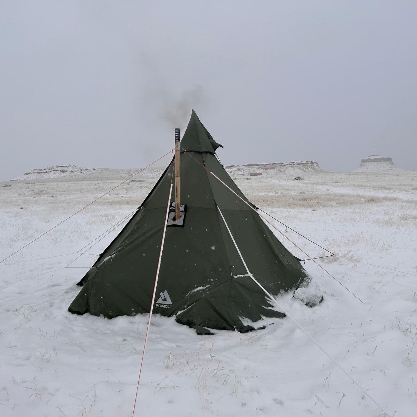 Titanium Large Foldable Wood Burning Stove - in-use image on the snowfield