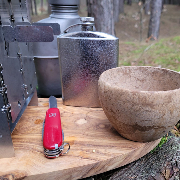 
                  
                    Titanium Hip Flask With Funnel - 220ml/7.74 fl oz - crystallized finish - on a wood chopping board
                  
                
