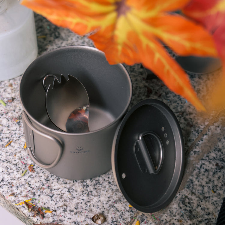 
                  
                    Ultralight Titanium Folding Spork with polished finish folded and placed in a titenium cup image
                  
                