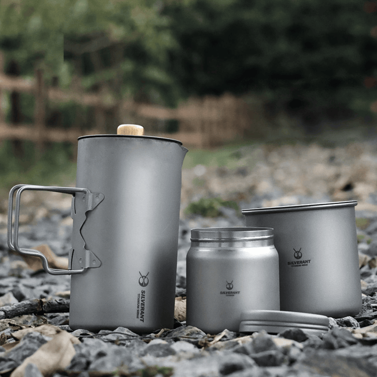 
                  
                    SilverAnt Titanium Coffee French Press Kit with Cup & Grounds Container - Actual product photo, complete kit set down on rocks, lifestyle shot
                  
                