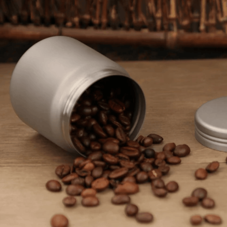 
                  
                    SilverAnt Titanium Coffee French Press Kit with Cup & Grounds Container - Actual product photo, creative shot, grounds container spilled coffee beans on wooden surface
                  
                