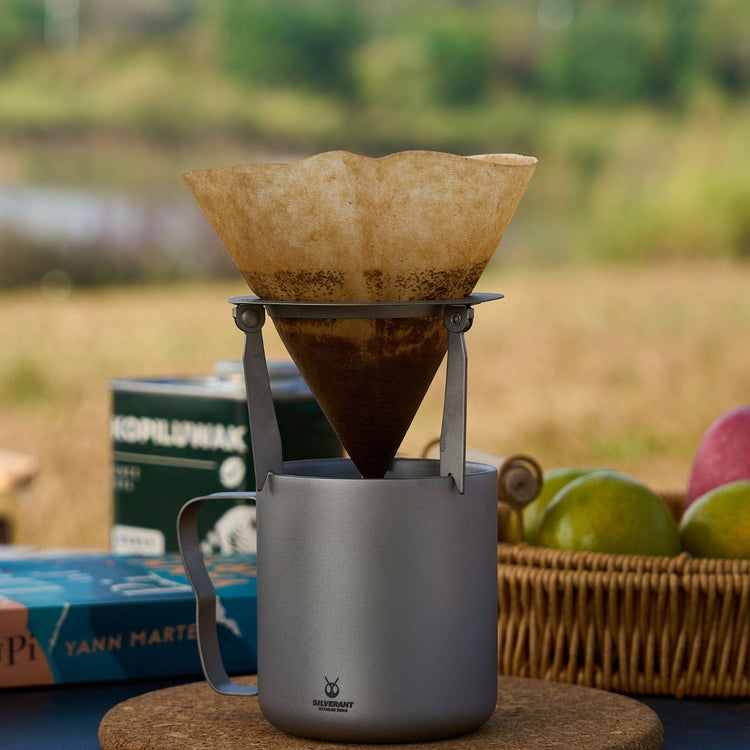 
                  
                    SilverAnt Titanium Double Wall Mug 300ml/10.14fl oz Classic Handles - Actual product photo, brewing pour-over coffee into the cup, real life still, lifestyle shot, camp coffee
                  
                