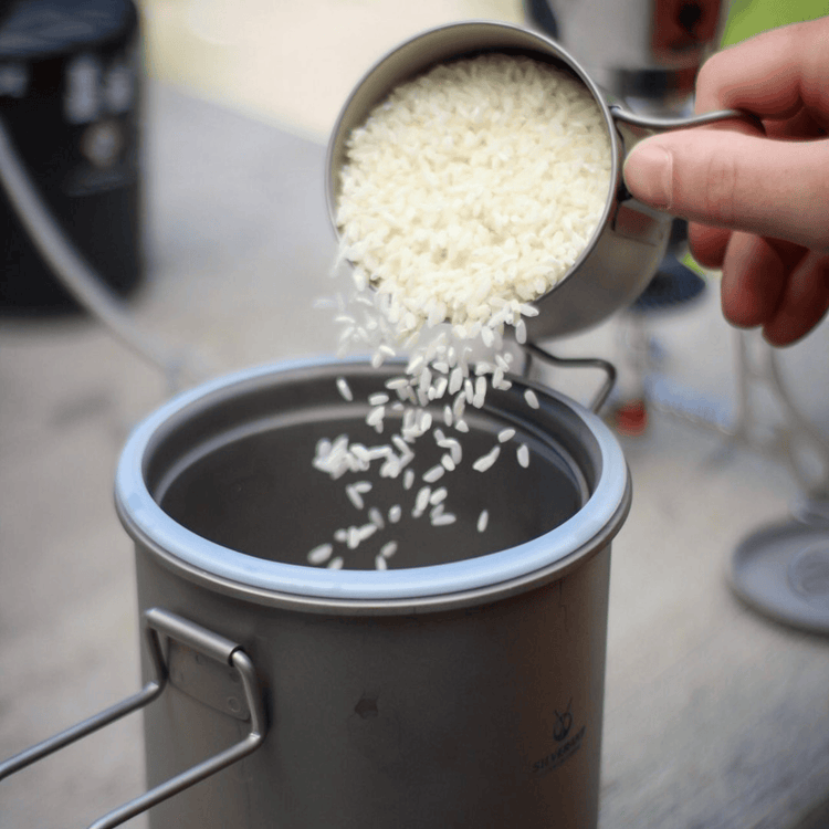 
                  
                    SilverAnt Outdoors Titanium Rice Cooker - In-Use (pouring rice inside)
                  
                