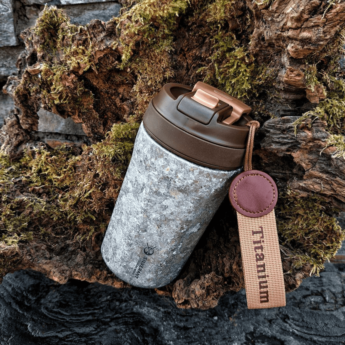 SilverAnt Ultralight Crystallized Titanium Insulated Travel Coffee Mug with Lid 400ml/14 fl oz Classic Silver - Actual product photo, lifestyle shot, laid on tree bark