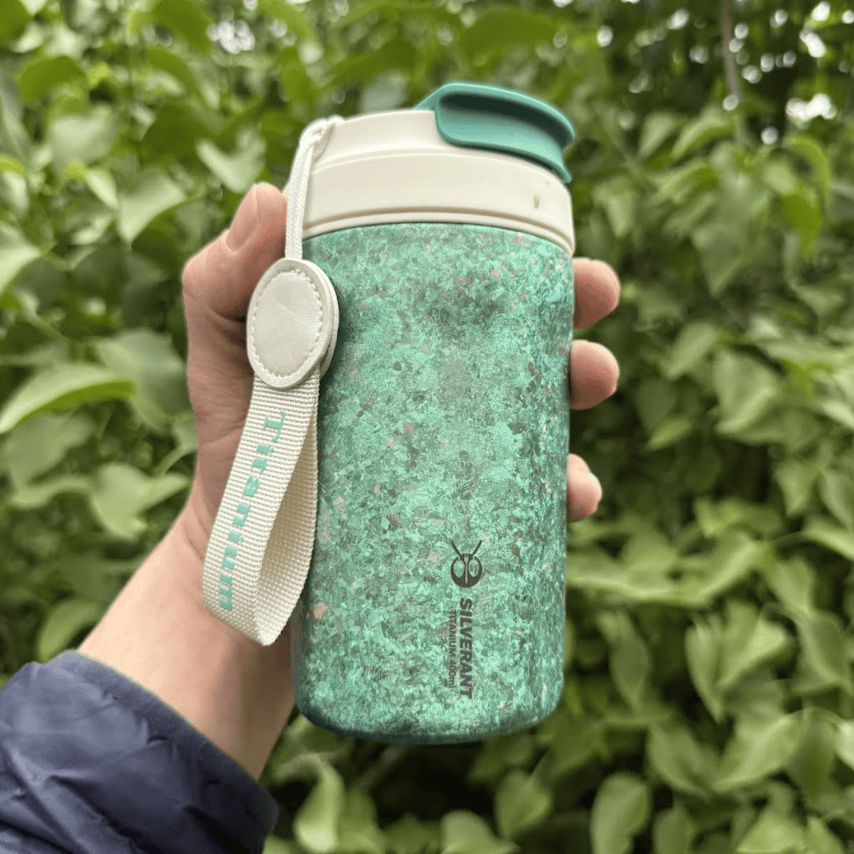 SilverAnt Ultralight Crystallized Titanium Insulated Travel Coffee Mug with Lid 400ml/14 fl oz Light Green - Actual product photo, on hand, lifestyle shot