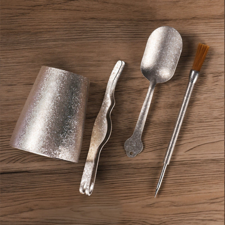 
                  
                    SilverAnt Ultralight Large Crystallized Titanium Travel Tea Set - accessories and utensils on a wooden surface, top view shot, real life use, actual product photo
                  
                