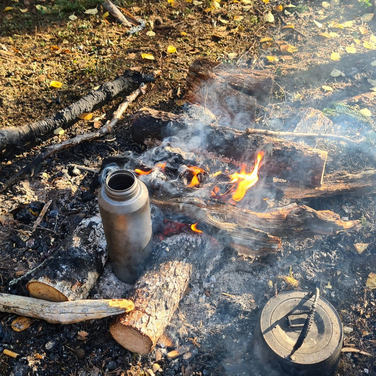 
                  
                    SilverAnt Ultralight Large Titanium Water Bottle With Titanium Cup - In-Use (actual product photo, boiling water, campfire)
                  
                