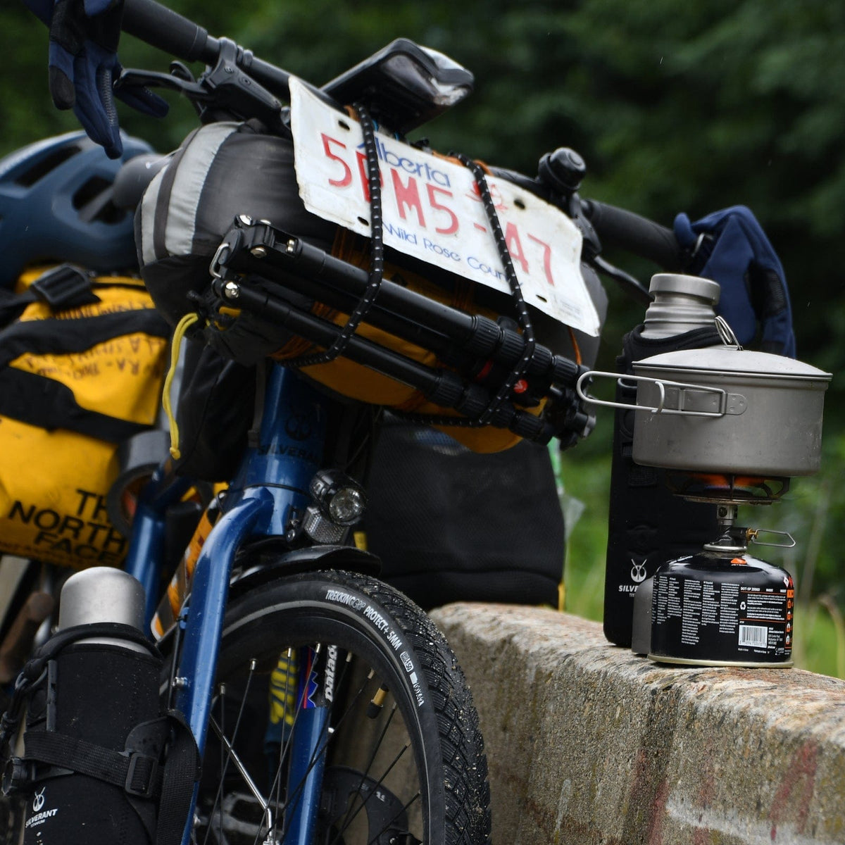 SilverAnt Ultralight Large Titanium Water Bottle With Titanium Cup - In-Use (actual product photo, strapped in bike compartment, bikepacking perfect water bottle)
