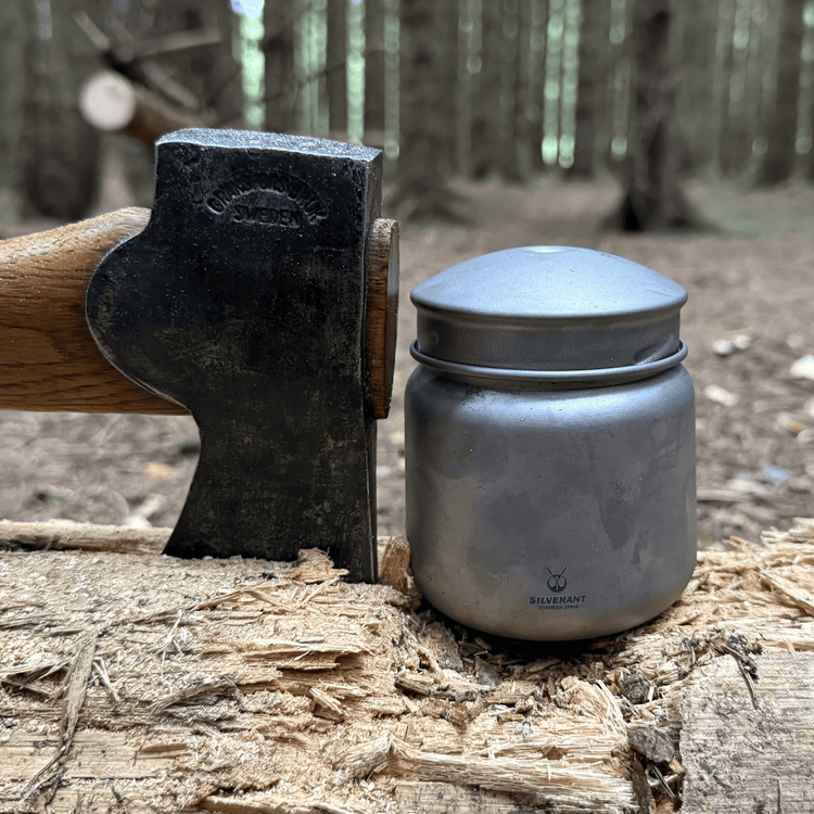 
                  
                    SilverAnt Ultralight Leakproof Titanium Container 280ml / 9.47 fl oz Sandblasted (actual product photo, placed on op of a tree log, with an axe wedged into the log by its side)
                  
                