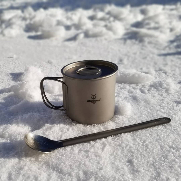 
                  
                    SilverAnt Ultralight Long Handle Titanium Spoon Polished - actual product photo, real life use, placed in snow with titanium cup
                  
                