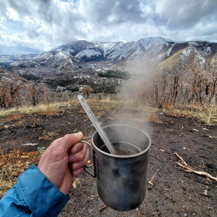 
                  
                    SilverAnt Ultralight Long Handle Titanium Spoon - actual product photo, real life use, in use, beautiful mountain view in the background
                  
                