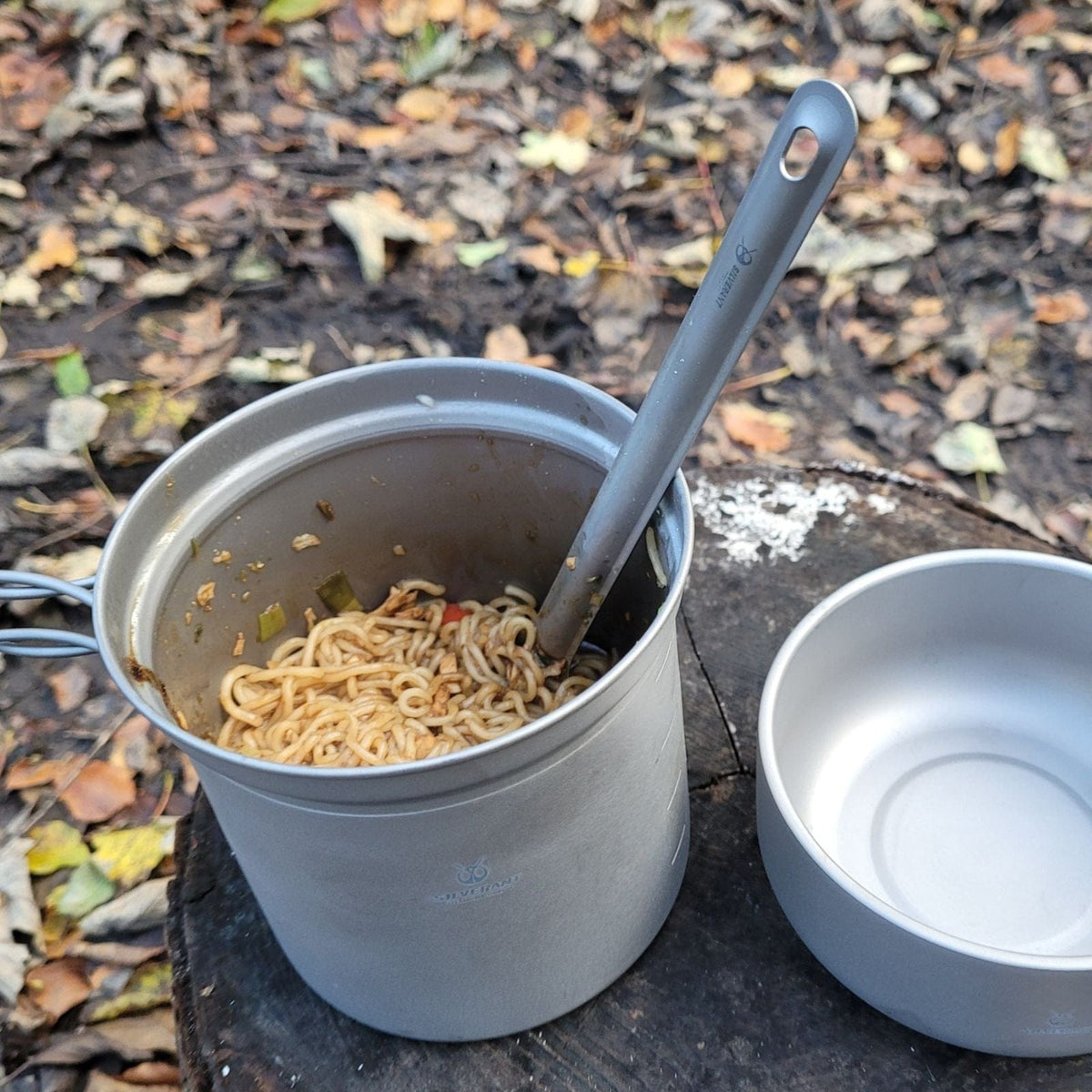 SilverAnt Ultralight Long Handle Titanium Spork Sandblasted - actual product photo, real life use, in use, on a titanium cup used for eating noodles