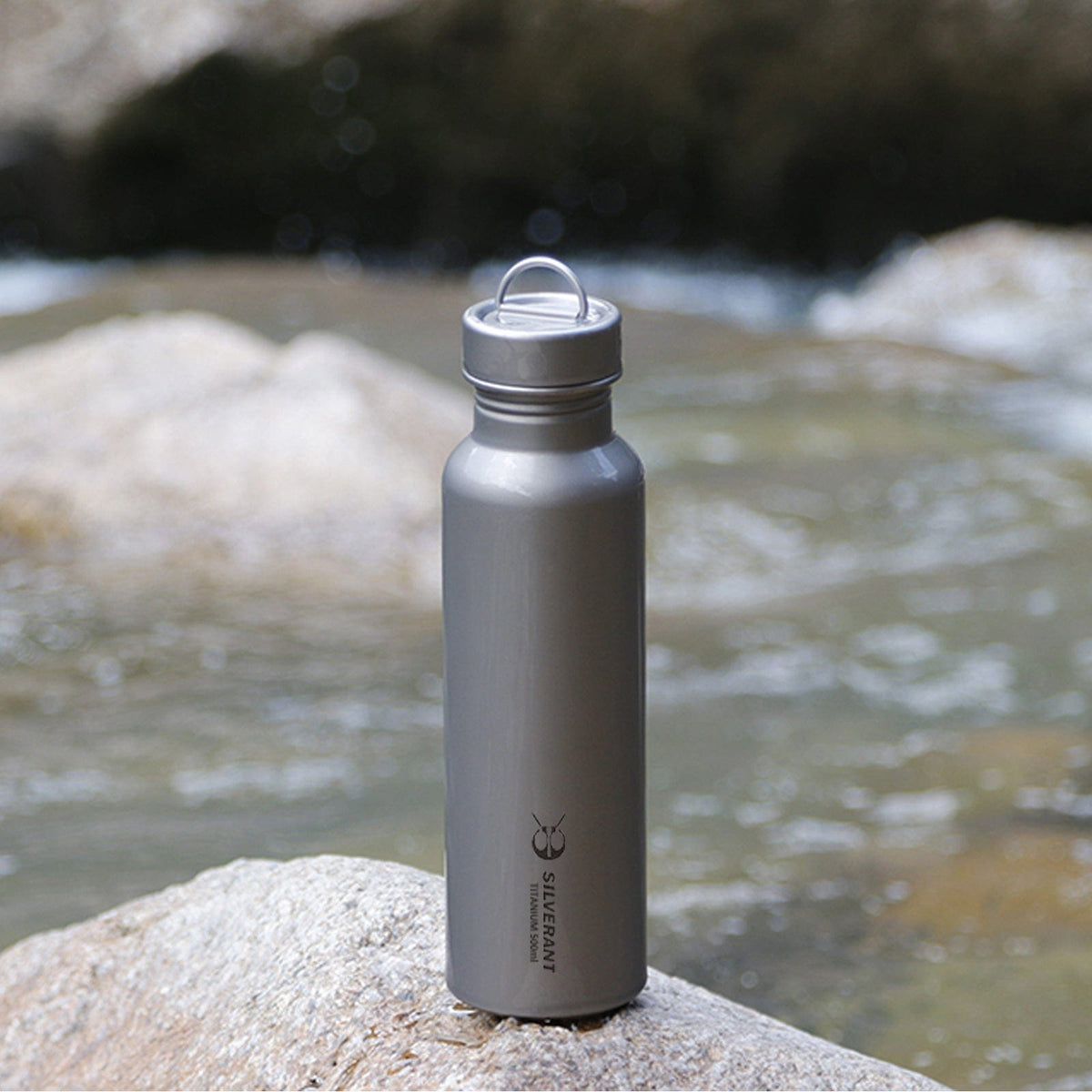 SilverAnt Ultralight Round Titanium Water Bottle - 500ml - In-Use (actual product photo, pictured in front of river)