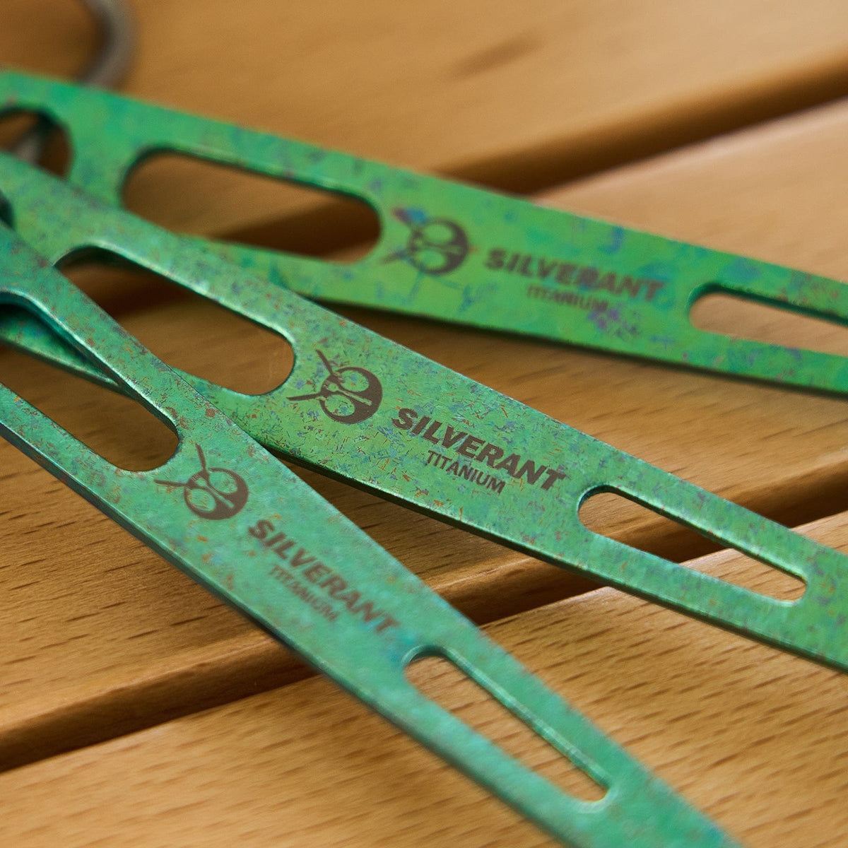 SilverAnt Ultralight Titanium 3-Piece Cutlery Set (Kinfe, Fork, and Spoon) Anodized Green - actual product photo, close-up of silverant branding, green anodized finish, lifestyle shot