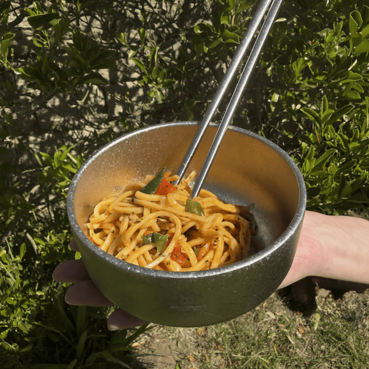 SilverAnt Ultralight Titanium Backcountry Double Wall Bowl Crystallized - In-Use (outdoors, held by hand, eating noodles with titanium chopsticks)