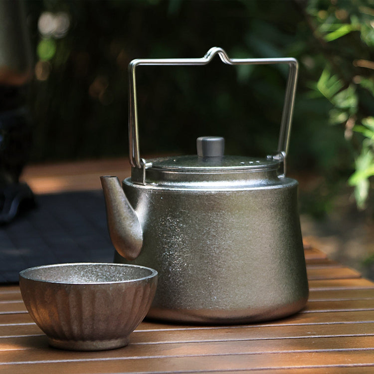
                  
                    SilverAnt Ultralight Titanium Bushcraft Kettle Crystallized Finish - In-Use (with a titanium tea cup)
                  
                