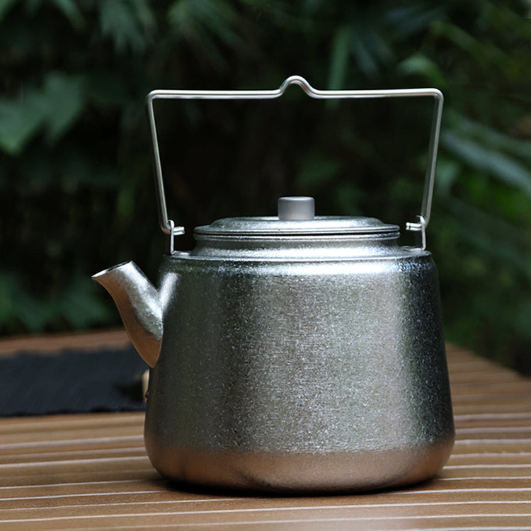 
                  
                    SilverAnt Ultralight Titanium Bushcraft Kettle Crystallized Finish 1500ml - In-Use (On a table)
                  
                