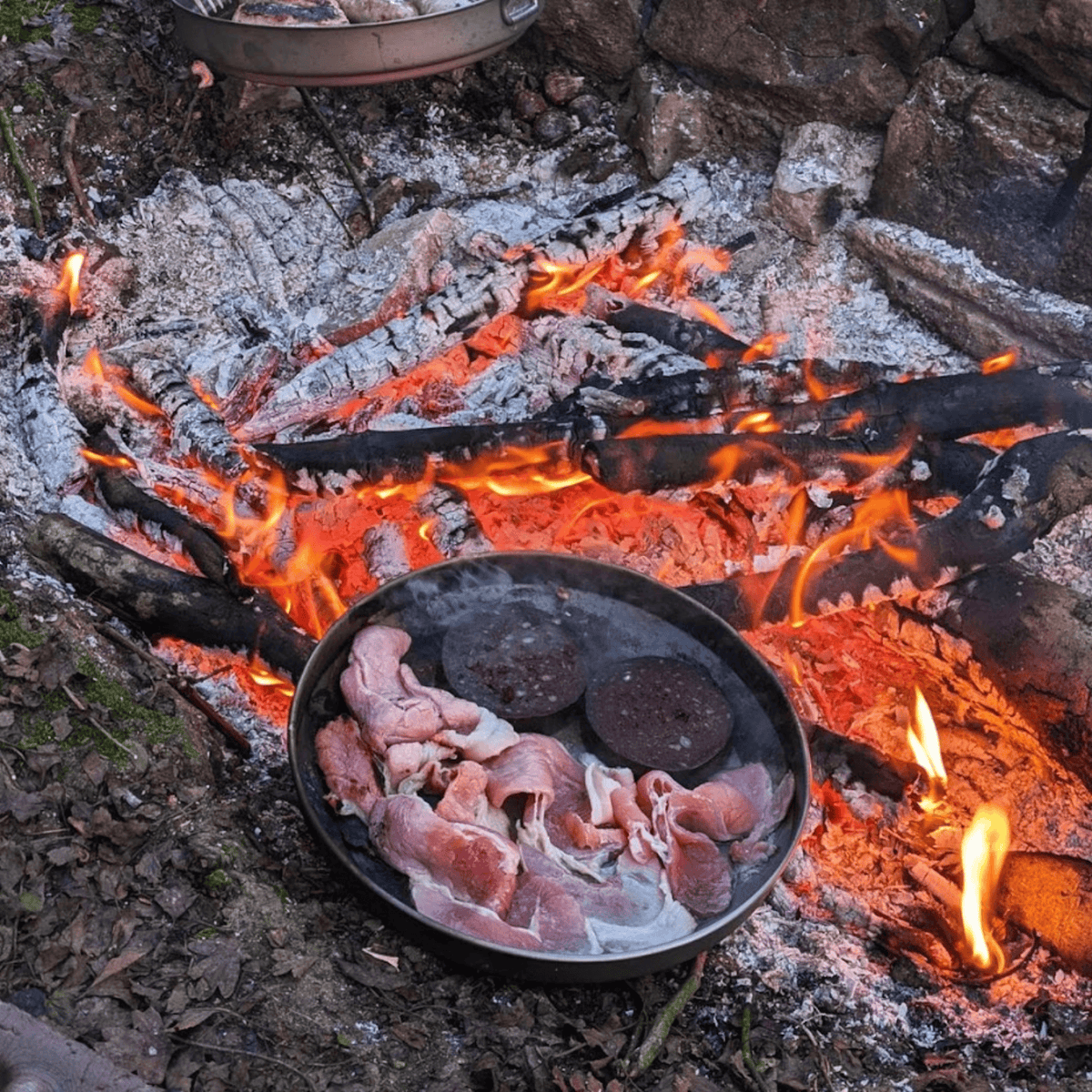 SilverAnt Ultralight Titanium Camping Plates -  900ml/30.43 fl oz & 1200ml/40.57 fl oz - In-Use (Plates being used to cook meat over fire)