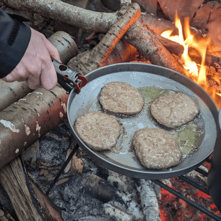 
                  
                    SilverAnt Ultralight Titanium Camping Plates -  900ml/30.43 fl oz & 1200ml/40.57 fl oz - In-Use (Being used to cook burgers over fire)
                  
                