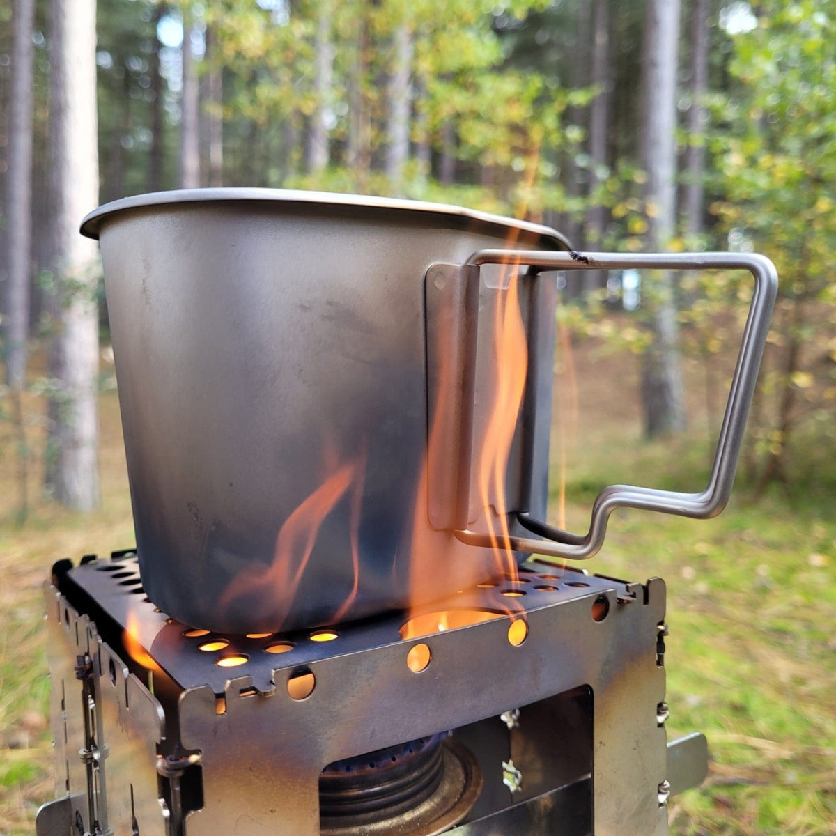 SilverAnt Ultralight Titanium Canteen Military Mess Kit - In-Use (close-up of patina in canteen cup being used to cook something on top of stove)