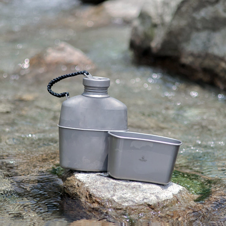 
                  
                    SilverAnt Ultralight Titanium Canteen Military Mess Kit with Paracord - In-Use (Actual product photo, lifestyle shot, river)
                  
                