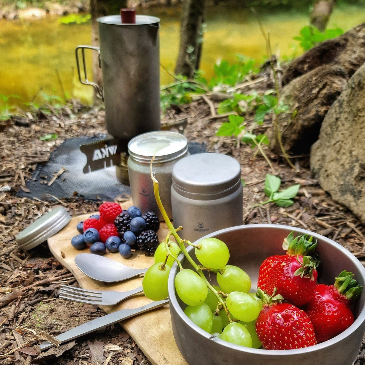 SilverAnt Ultralight Titanium Coffee French Press Sandblasted - Actual product photo, in the background, eating berries and grapes with various SilverAnt gear and utensils