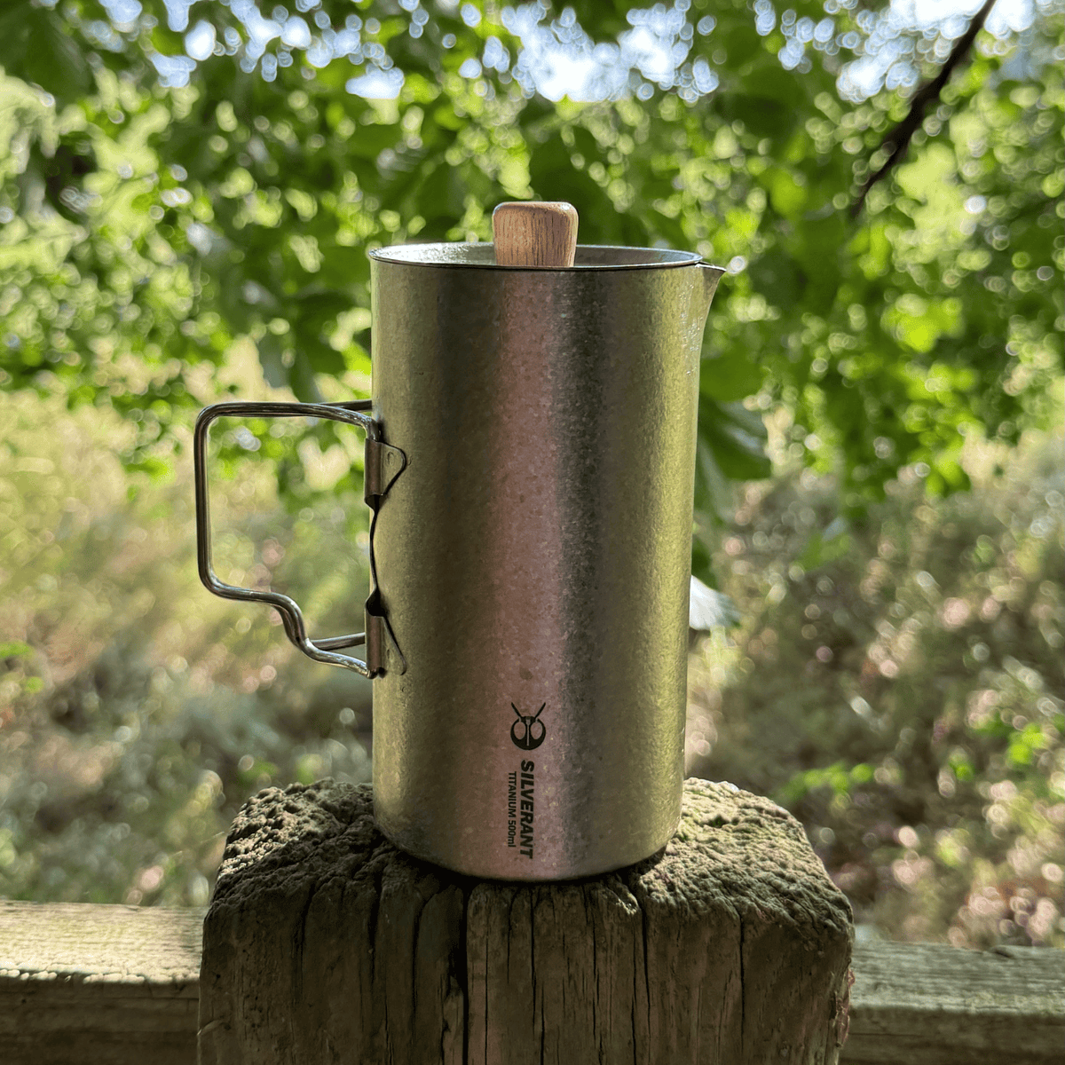 SilverAnt Ultralight Titanium Coffee French Press Crystallized - Lifestyle shot, photographed on top of a wooden fence pole, close-up of finish