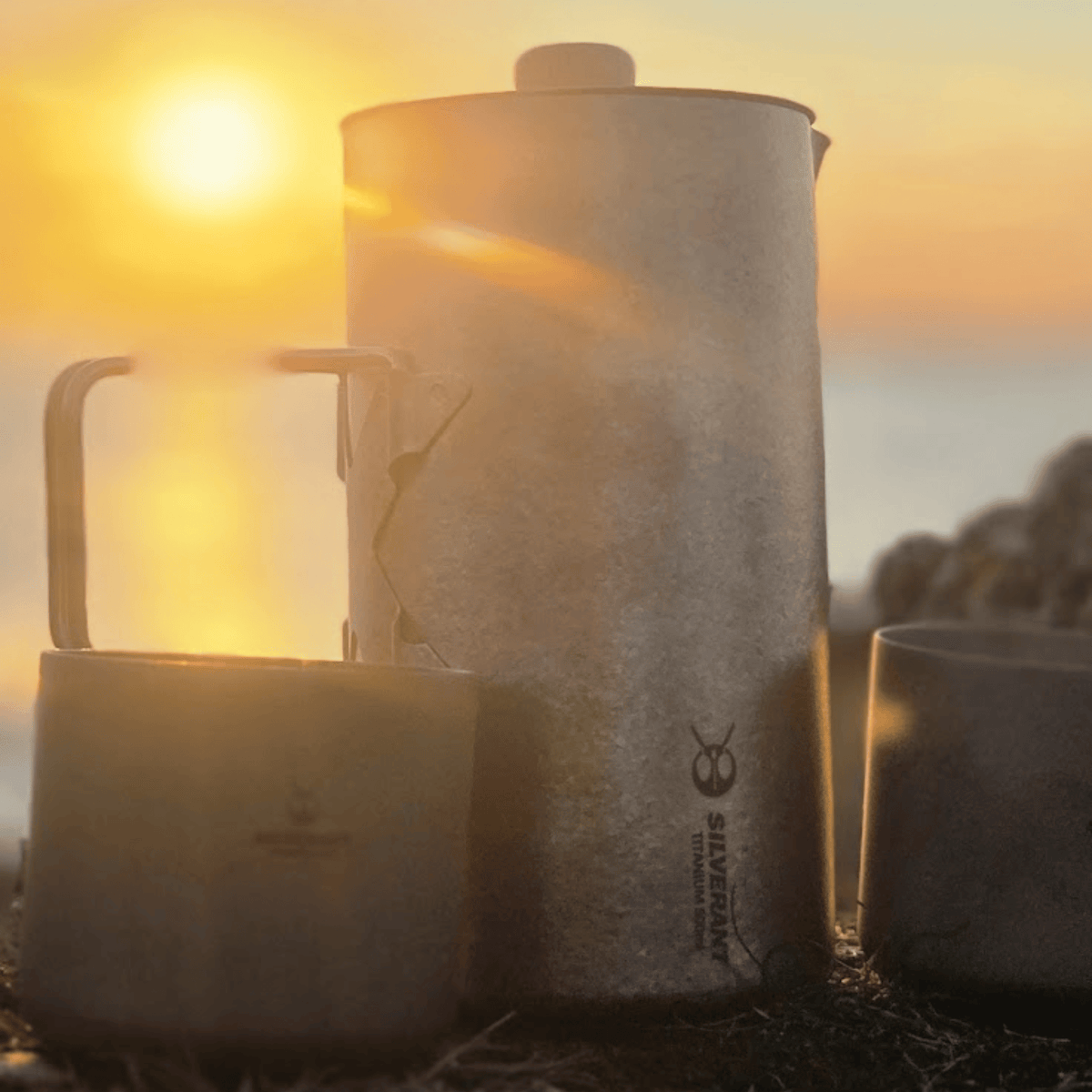 SilverAnt Ultralight Titanium Coffee French Press Crystallized - Actual product photo, lifestyle shot, with beautiful sunset scene on the background