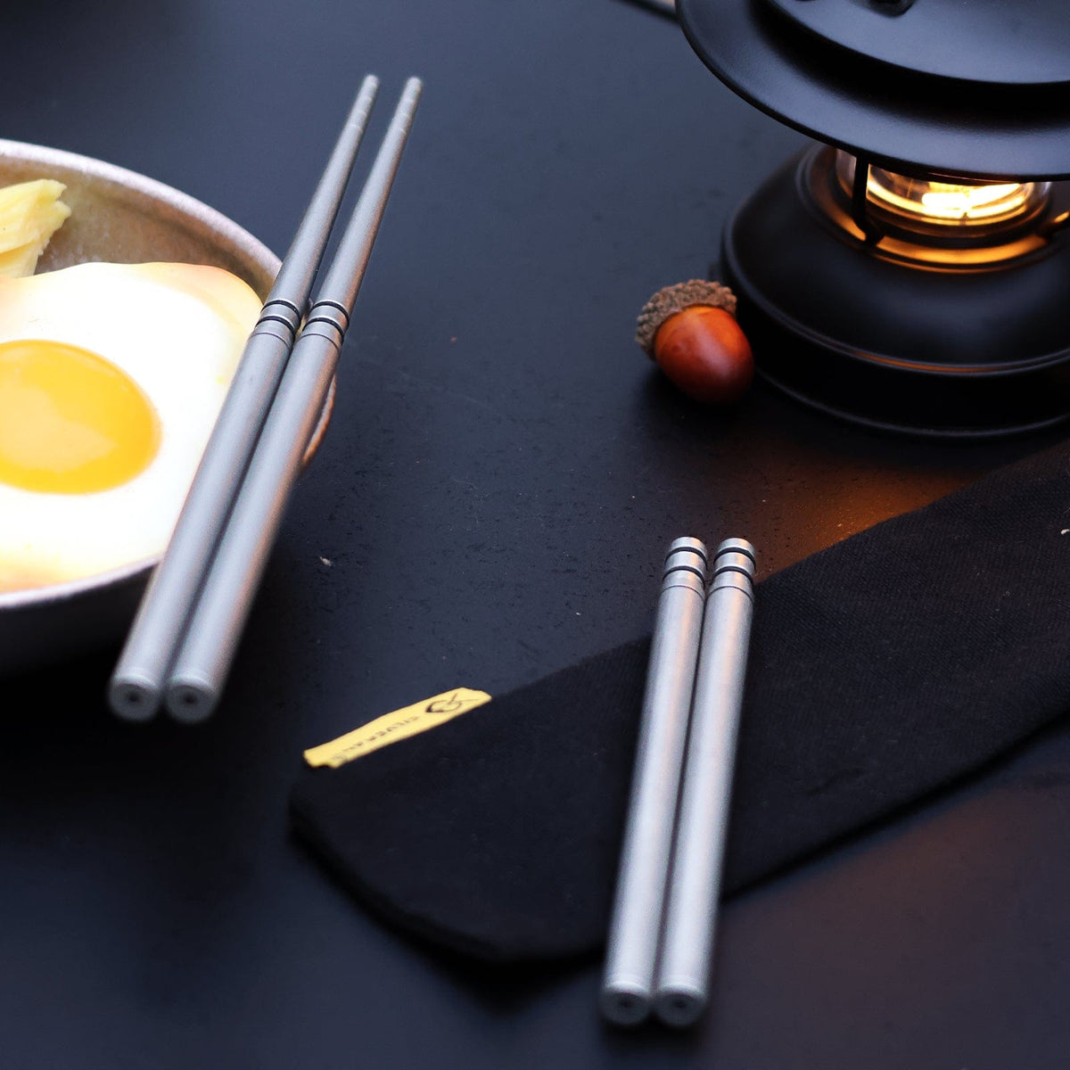 SilverAnt Ultralight Titanium Collapsible Folding Travel Chopsticks - actual product photo, lifestyle shot, real life setting