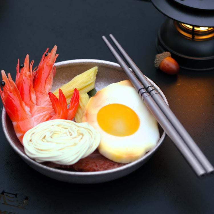 
                  
                    SilverAnt Ultralight Titanium Collapsible Folding Travel Chopsticks - Actual product photo, lifestyle shot, bowl of shrimp, egg, and veggies
                  
                