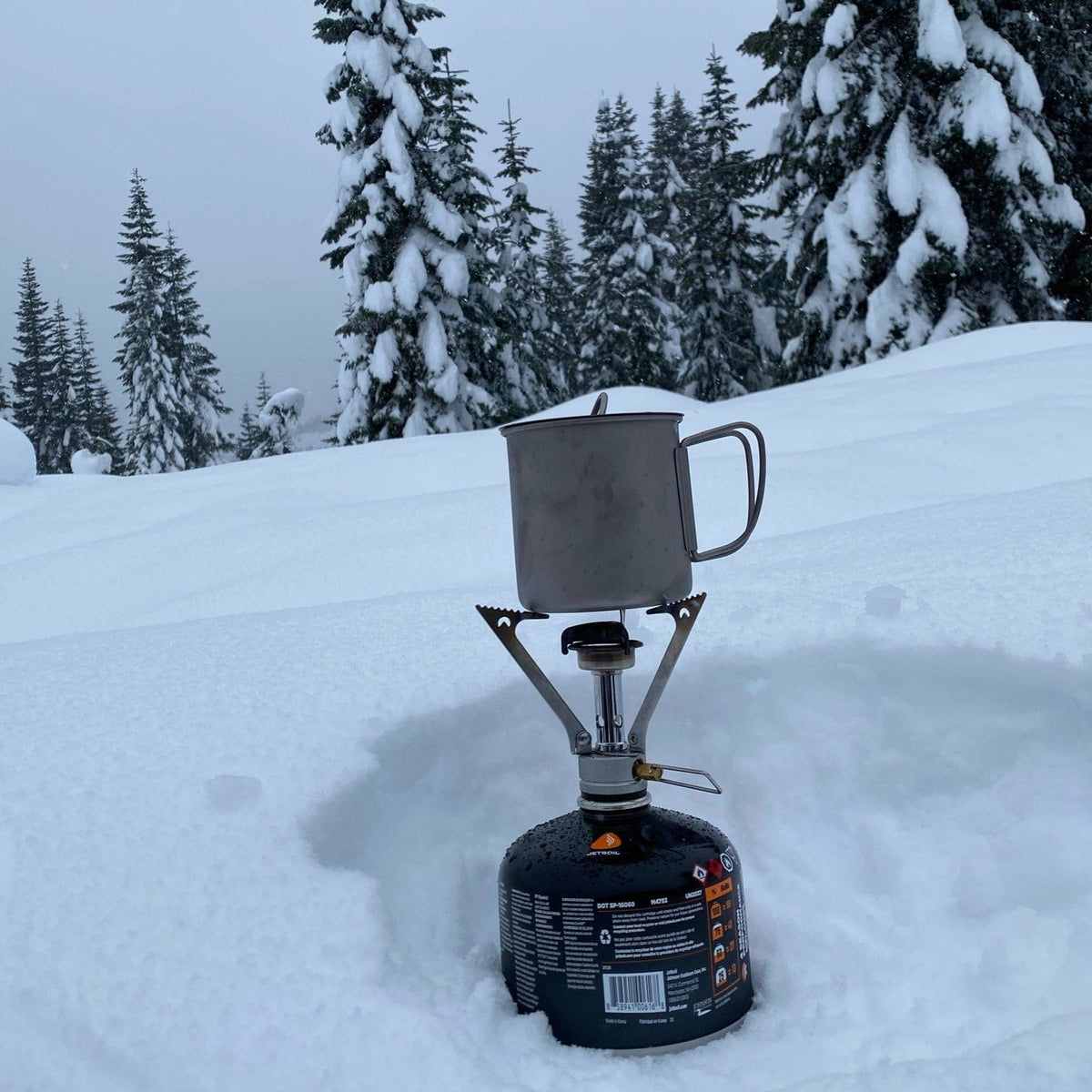 SilverAnt Ultralight Titanium Cup With Lid 4 Sizes - 400ml - actual product photo, winter camping, real life use, on top of a gas stove