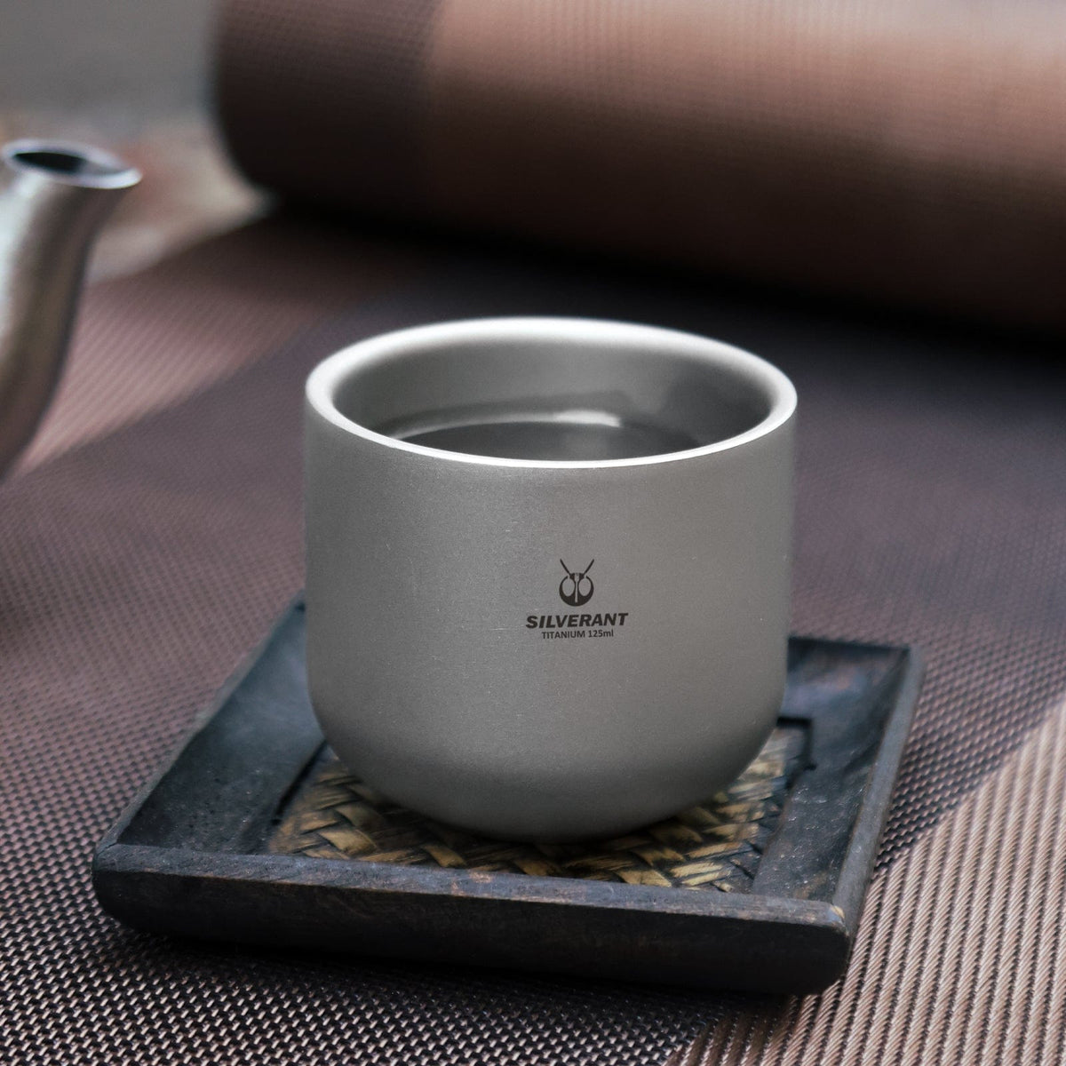 SilerAnt Outdoors Titanium Tea Cup Double Wall 125ml/4.22 fl oz Sandblasted - in-use image, actual product photo, placed on the tea cup plate