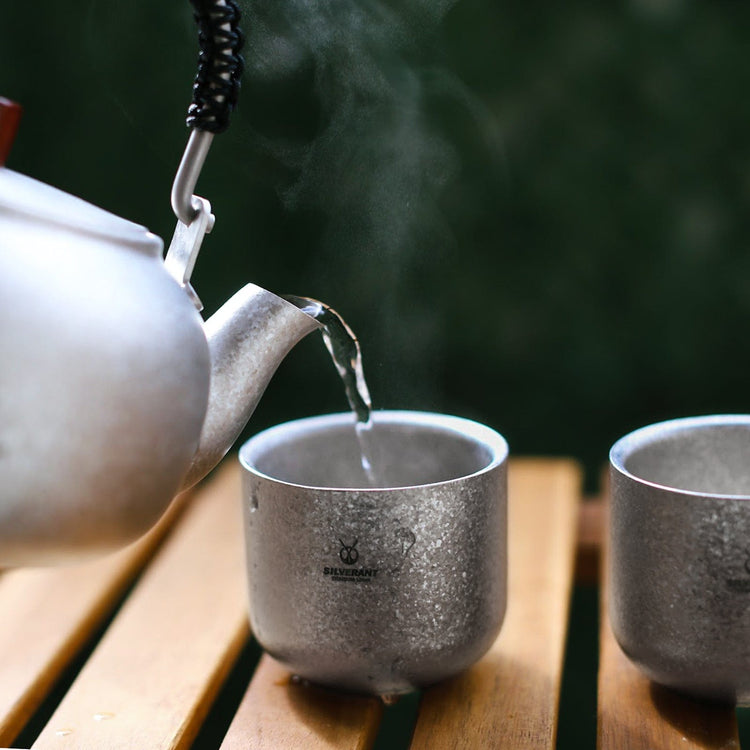 
                  
                    SilerAnt Outdoors Titanium Tea Cup Double Wall 125ml/4.22 fl oz Crystallized Finish (in-use, real-life use, actual product photo, pouring water into it from tea pot)
                  
                