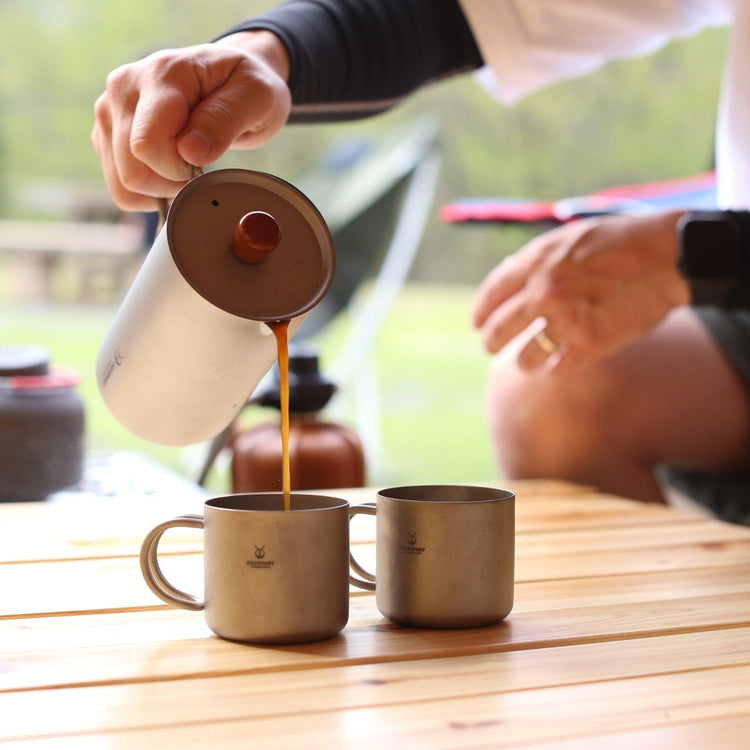 
                  
                    SilverAnt Ultralight Titanium Double Wall Espresso Coffee Cup 110ml/3.71 fl oz With Handle - Actual product photo, in use, real life still, real life setting, lifestyle shot, pouring coffee from SilverAnt Coffee French Press Sandblasted, camp coffee
                  
                