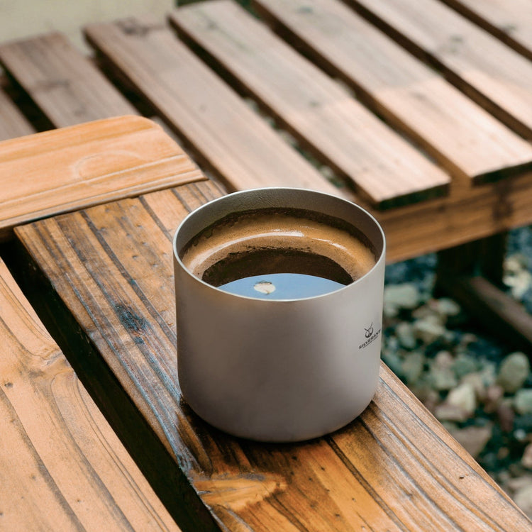 
                  
                    SilverAnt Titanium Double Wall Espresso Coffee Cup 110ml/3.71 fl oz Without Handle - Actual product photo, real life still, lifestyle shot, on a wooden plank table, filled with coffee, camp coffee
                  
                