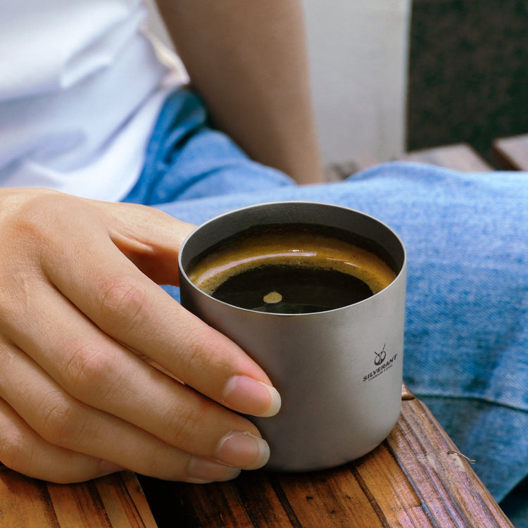 
                  
                    SilverAnt Ultralight Titanium Double Wall Espresso Coffee Cup 110ml/3.71 fl oz Without Handle - on hand, in use, real life still, lifestyle shot, camp coffee set-up
                  
                