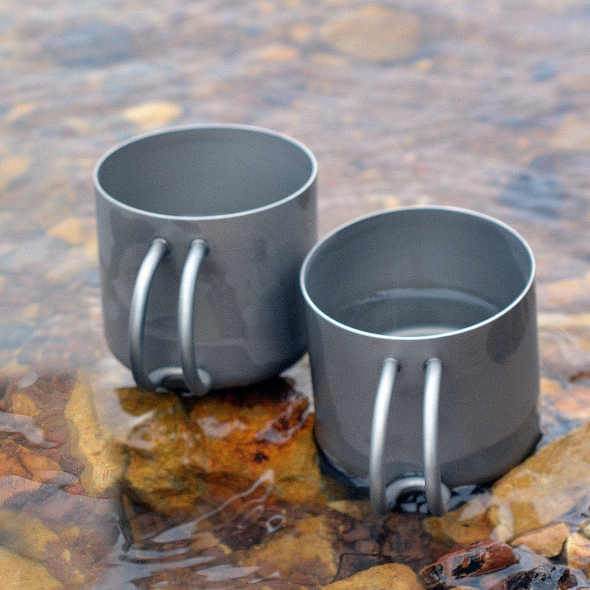 SilverAnt Ultralight Titanium Double Wall Espresso Coffee Cup 110ml/3.71 fl oz With Handle - Actual product photo, lifestyle shot, placed on water