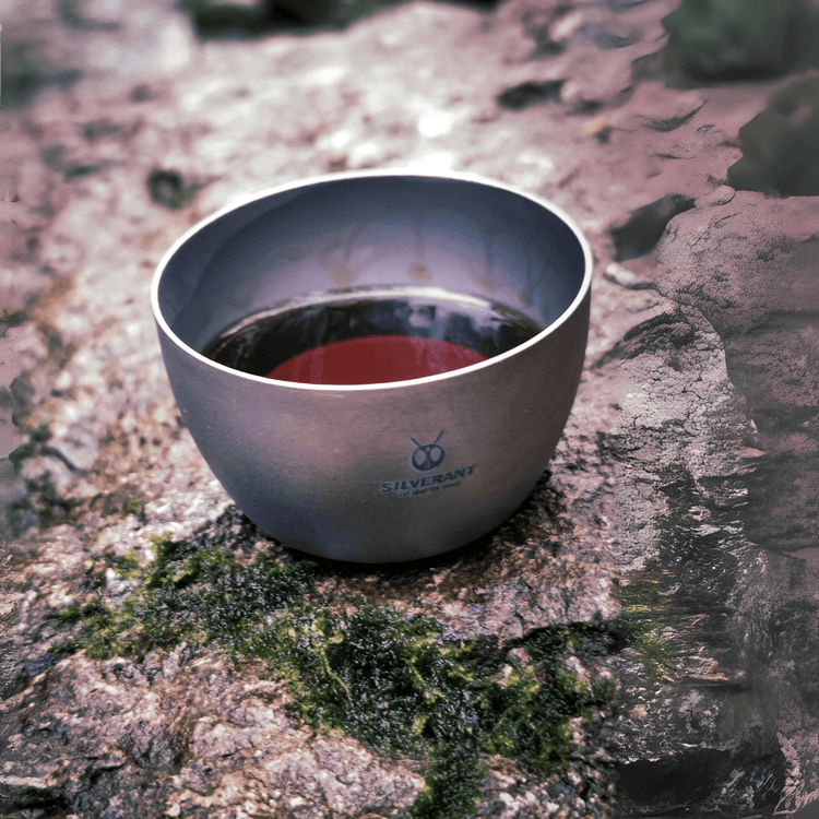 
                  
                    SilverAnt Ultralight Titanium Hip Flask 450ml/15.22 fl oz & Shot Glasses - Actual product photo, close-up of shot glass on a mossy rock, lifestyle shot
                  
                