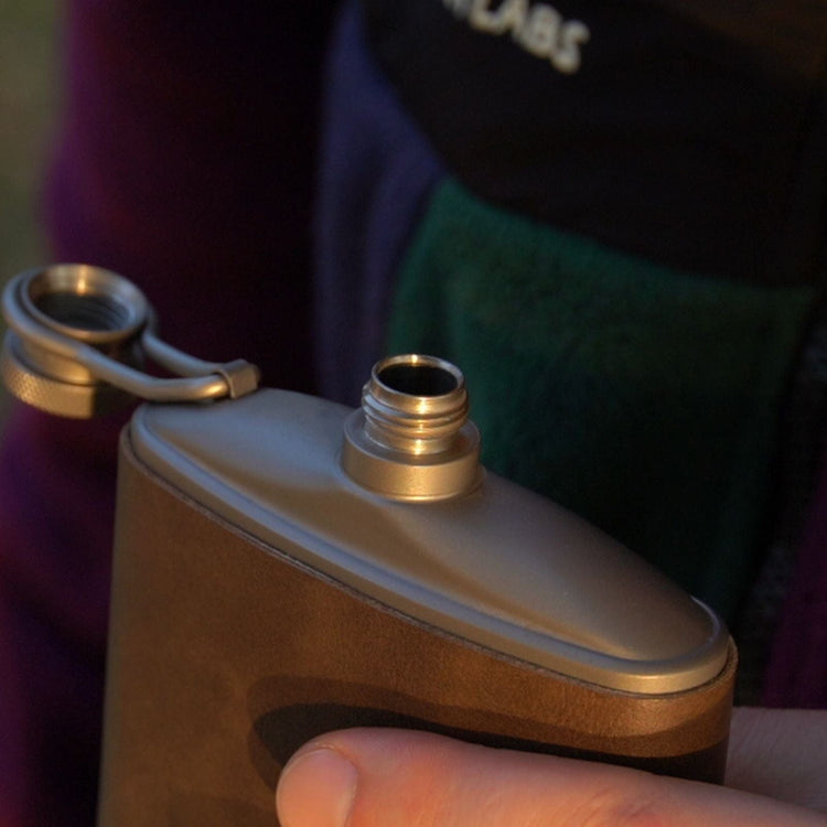 
                  
                    SilverAnt Ultralight Titanium Hip Flask and Funnel 248ml/8.73 fl oz PU Leather Sleeve (actual product photo, real life use, close-up)
                  
                