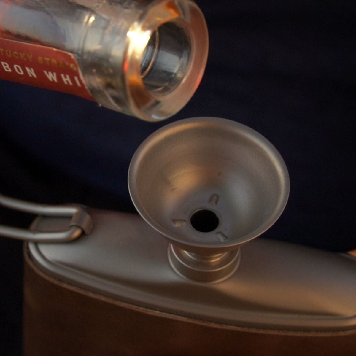 SilverAnt Outdoors Titanium Hip Flask and Funnel 248ml/8.73 fl oz with PU leather with the funnel on