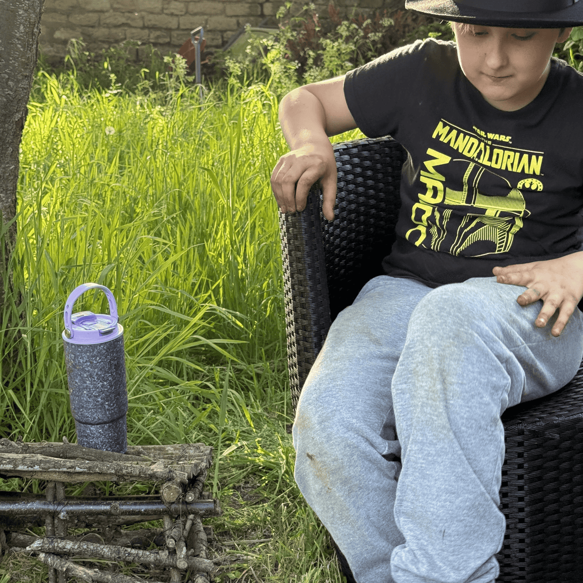 SilverAnt Crystallized Titanium Insulated Tumbler 880ml / 29.76 fl oz - Bue/Violet (actual product photo, kid sitting on a chair nearby)