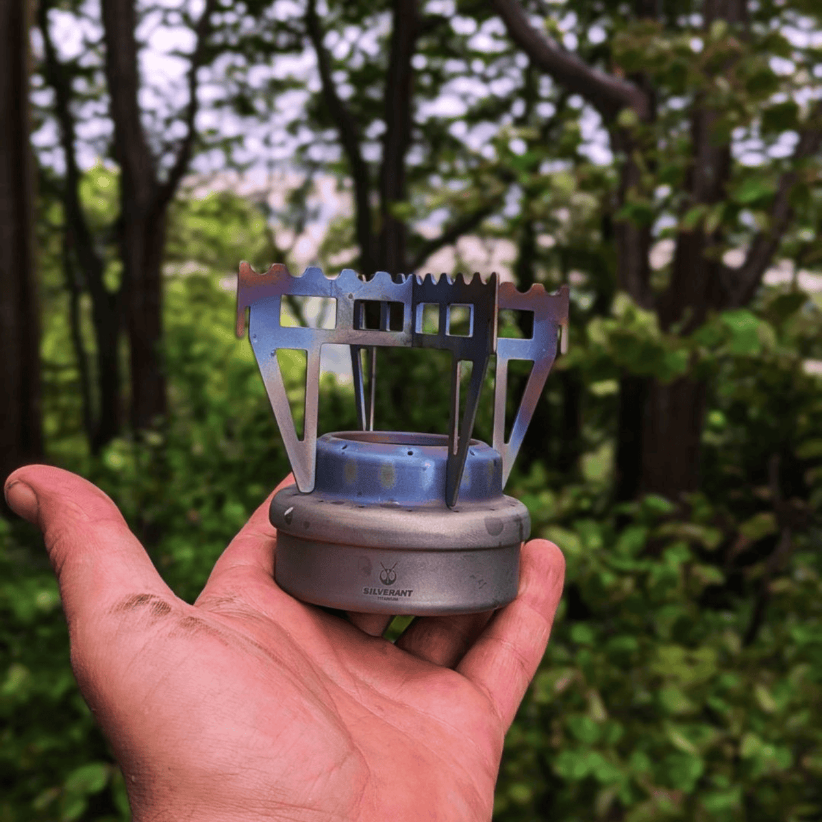 SilverAnt Ultralight Titanium Multi-Fuel Alcohol Stove Kit - Alcohol stove and Cross stand on-hand, actual product photo, real life photo, lifestyle photo