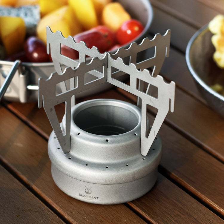 
                  
                    SilverAnt Ultralight Titanium Multi-Fuel Alcohol Stove & Cross Stand - actual product photo, close-up, lifestyle shot, top angle view
                  
                