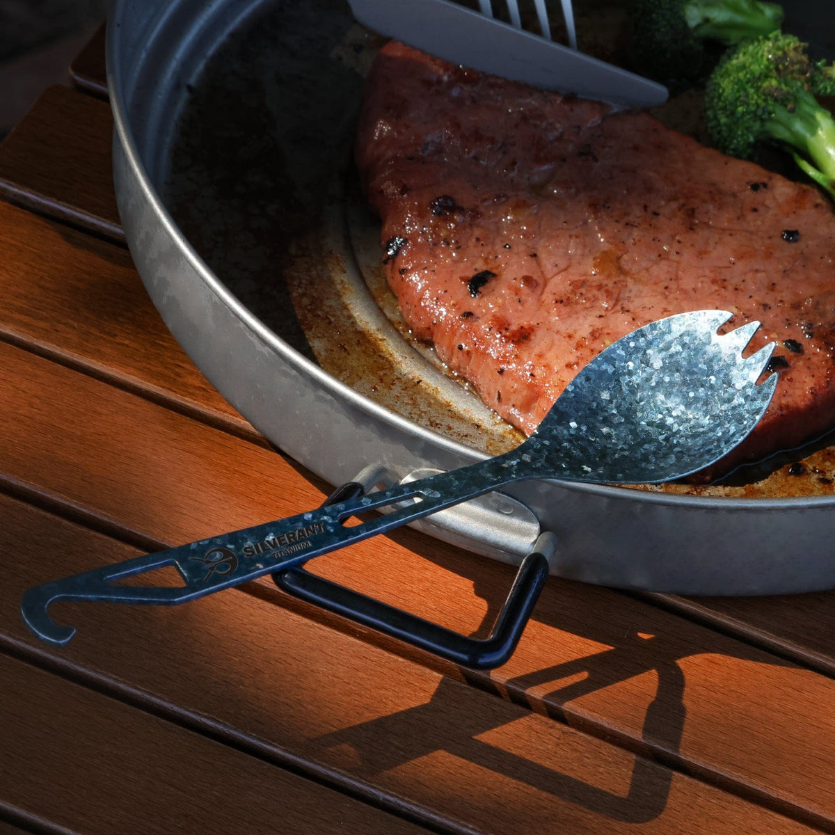 SilverAnt Ultralight Titanium Spork with Bottle Opener Anodized Blue - lifestyle shot, real life use, in use,close-up of blue anodized finish