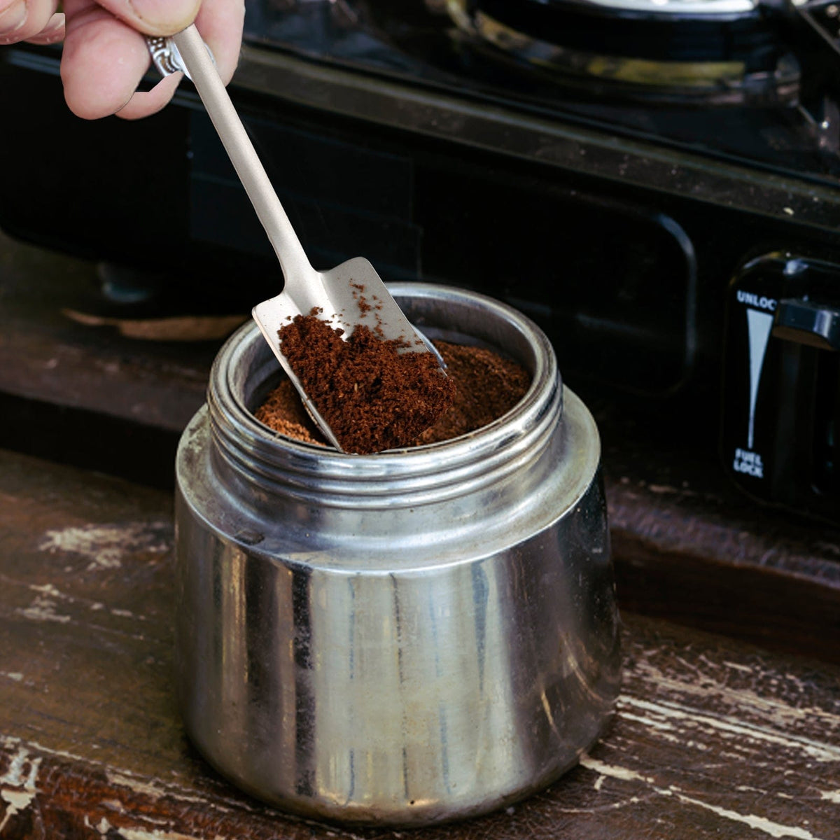 SilverAnt Ultralight Titanium Square & Spade Shovel Cutlery Utensils - Square shovel - actual product photo, in use, used for getting coffee grounds, real life setting, on hand